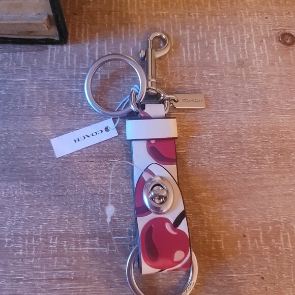 Coach Accessories - COACH - Handbag Charm with Cherry Print. Trigger Snap.  Brand new.